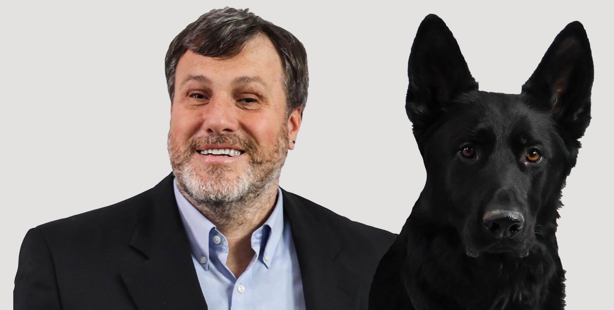 A portrait of Nicholas Giudice and his seeing-eye dog