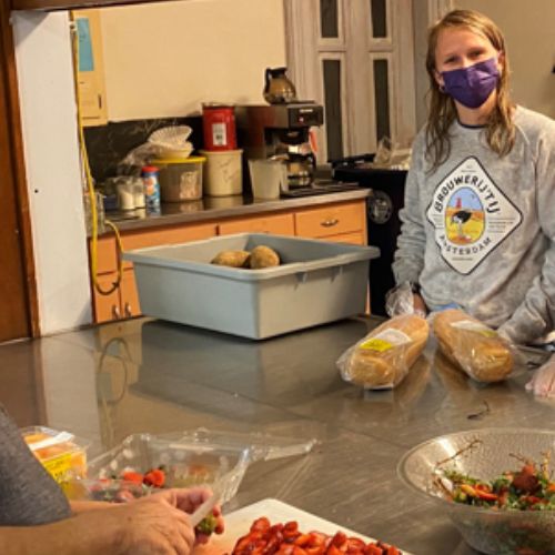 image of student intern packing food for a food rescue drop-off