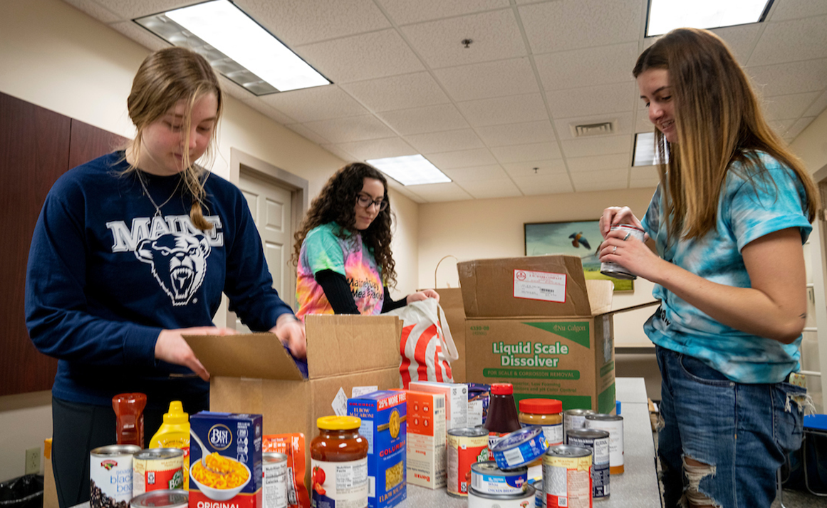 A photo of students putting together food donations