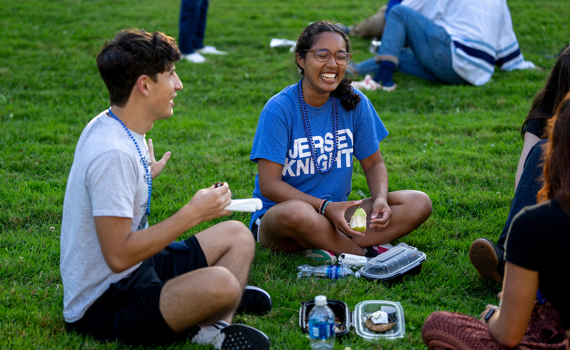 A photo of two students laughing