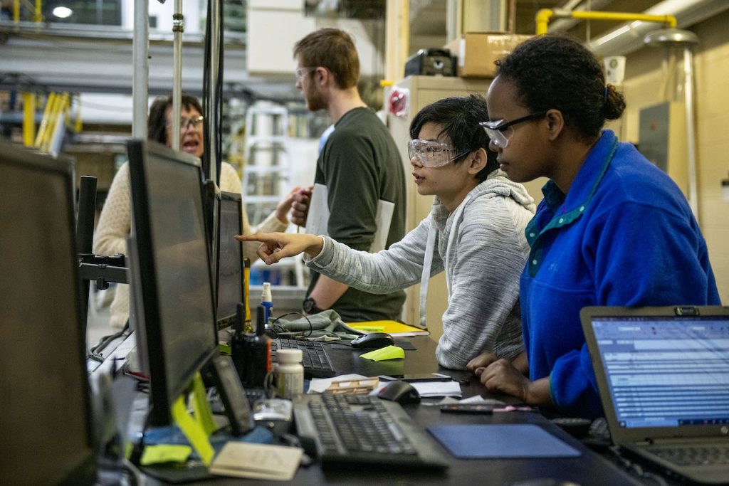 Two students sitting in front of a computer