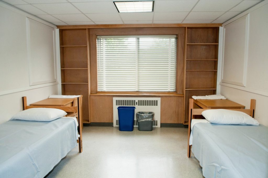 York double-single dorm room facing window