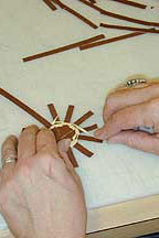 Image of the beginning steps of weaving described in text.
