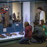 Image of people looking at a museum exhibit.