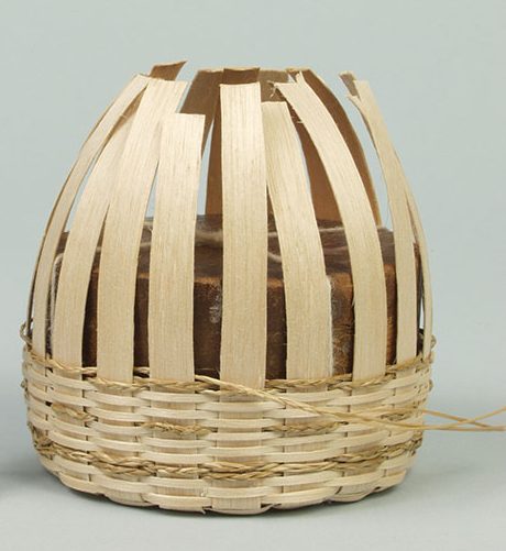 Image of a partially-completed basket with a mold inside.