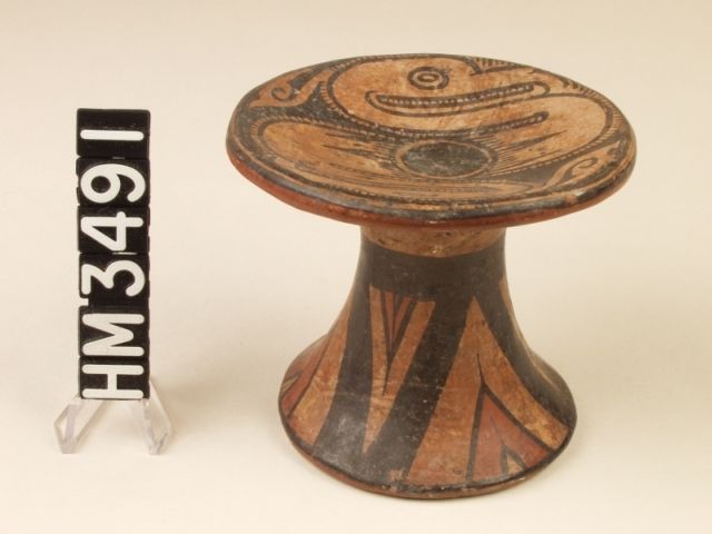 Miniature polychrome ceramic pedestal plate. Two elegant, long-billed birds, probably herons, are positioned at two ends of a serpent-like continuum broken in the center by a circle that may refer to the boa oval.