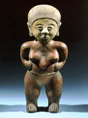 Standing ceramic figure with hands on hips.