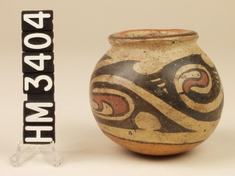 Miniature polychrome ceramic jar. The frieze of Y-elements with curly "tails" in a contrasting color, tucked within the curvilinear line of the Y-element, may represent a series of boa ovals, each containing a life form. The design can also be translated as the oval-rectangle boa sequence. 
