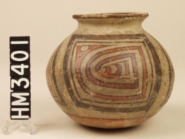 Miniature polychrome ceramic jar. The very angular but also serpentine Y-element design represents a pointy-nosed creature with an eye with a horizontal slit (the "gap" of the Y-element), a hint of an eye stripe and a distinctive claw, indicating a kenning for the iguana-boa.