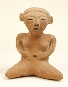 Small ceramic figurine with scar marks on cheeks.