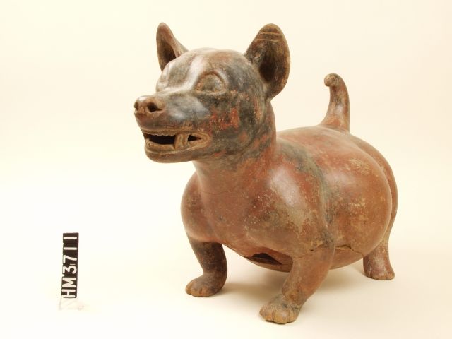 Image of a ceramic dog figure with burnished red surface.
