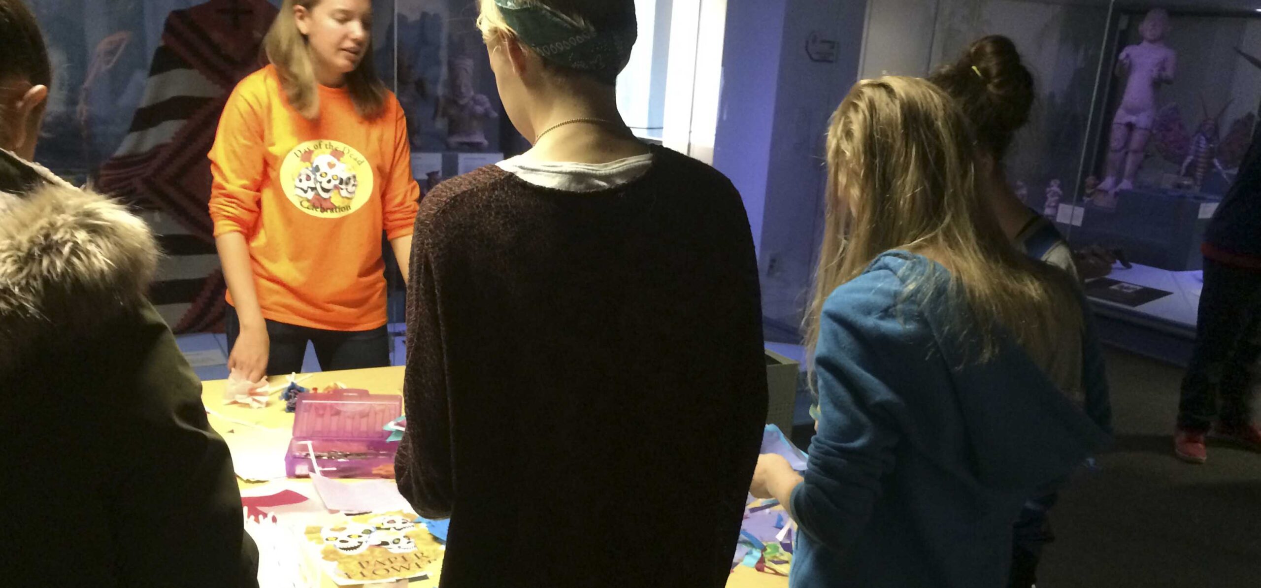 Students looking at Hudson Museum display