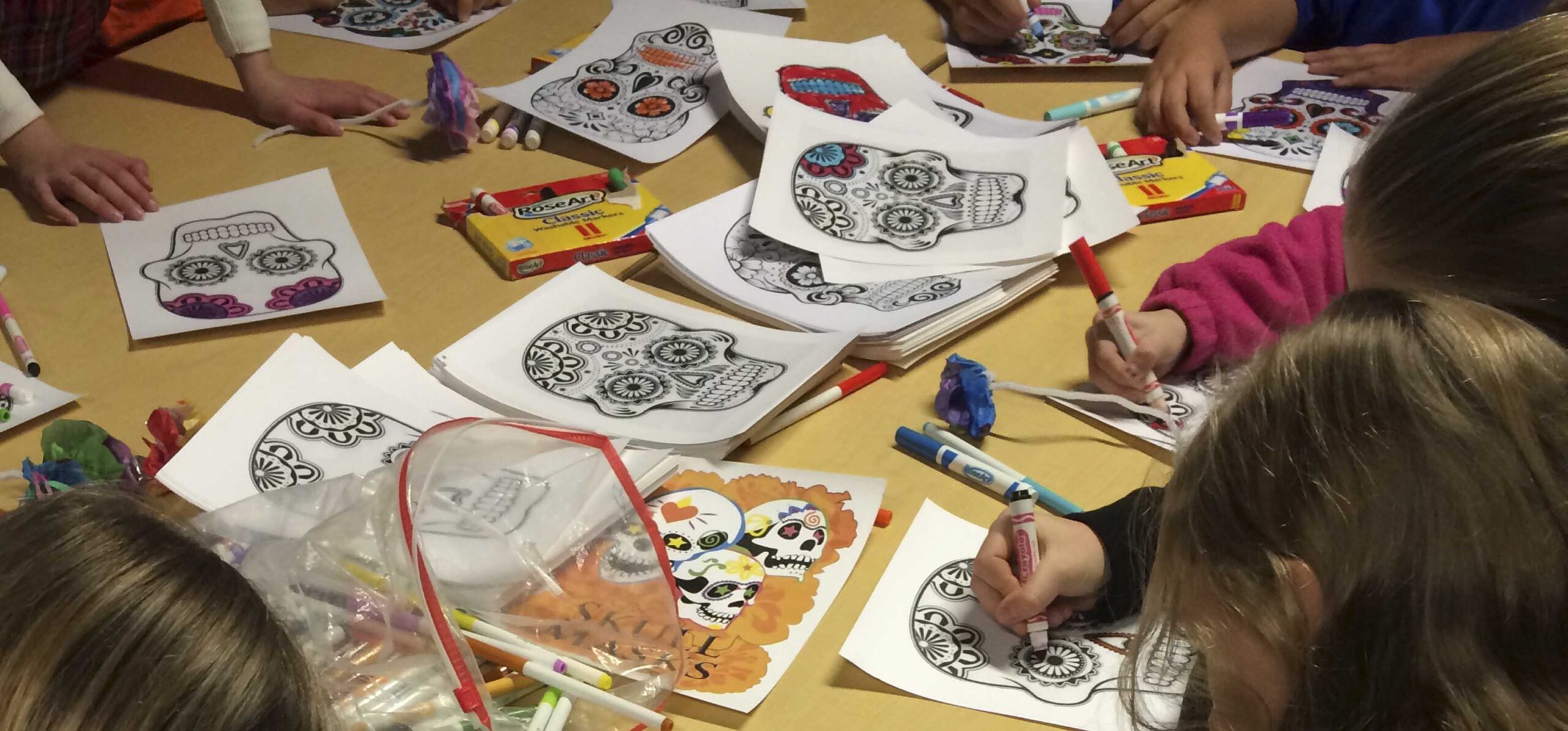 Students looking at Hudson Museum display