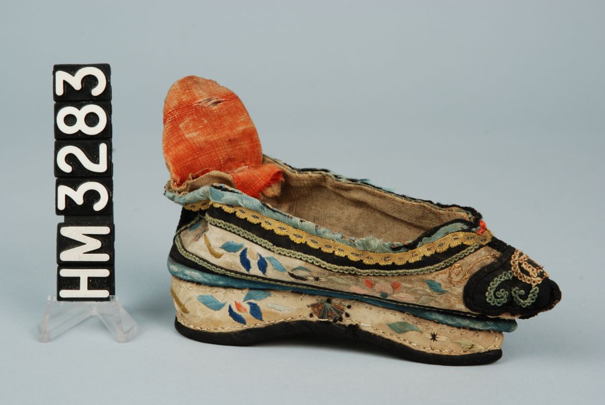 Image of a small shoe with intricate embroidery.