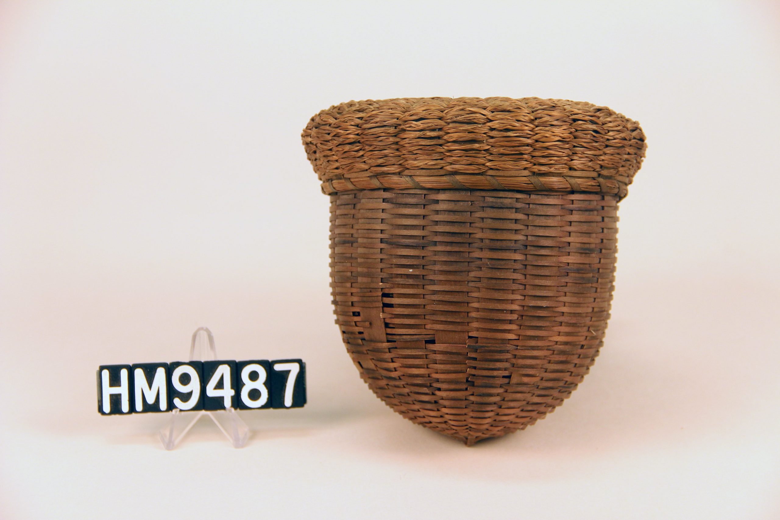 Image of basket woven in shape of acorn.