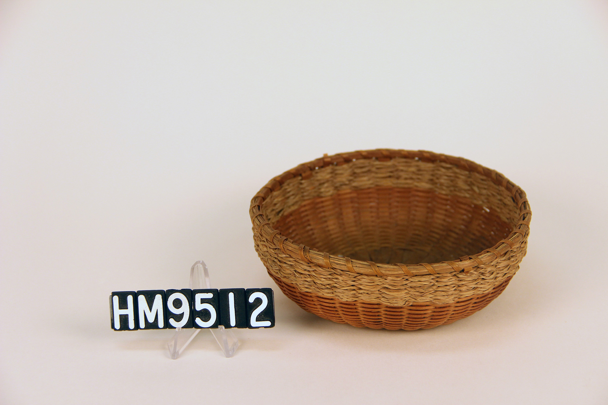 Small basket in the shape of a bowl.