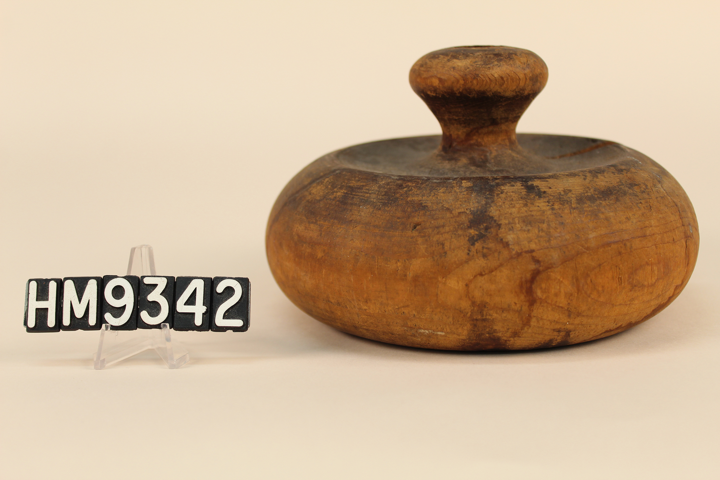 Image of a basket block for urchin baskets with a tapered handle.