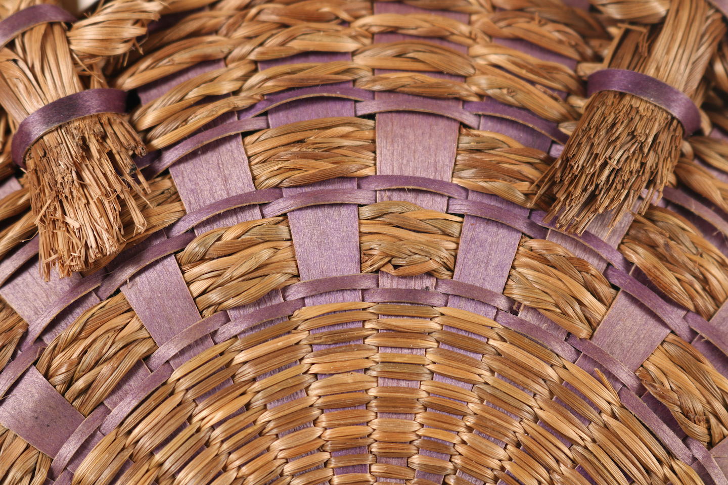 Image showing detail of a woven basket including braided sweetgrass and purple ash splints.