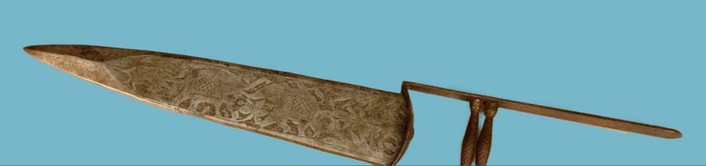 Sword with intricately etched blade and handle designed to allow blade to be used in a punching motion.