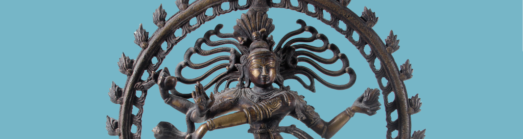 Image of bronze casting on blue background. Casting shows multi-armed deity surrounded by flames.
