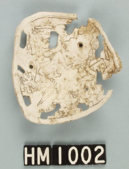Image of shell with pierced and incised designs.