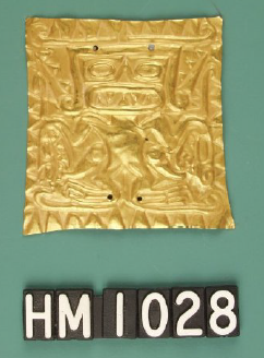 Image of a rectangular gold ornament with impressed design of a figure with sharp teeth.