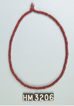 Image of a single strand of rich red beads.