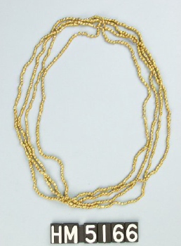 Image of multi-strand necklace made of small gold beads.