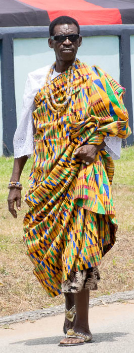 An African man wearing a colorful fabric wrap.