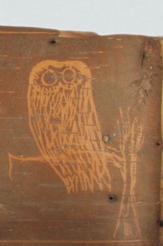 Image of an owl etched into birchbark.