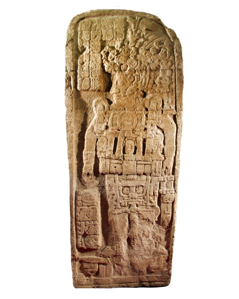 Image of a stone carved stele with the full-body depiction of a person wearing an ornate headdress.