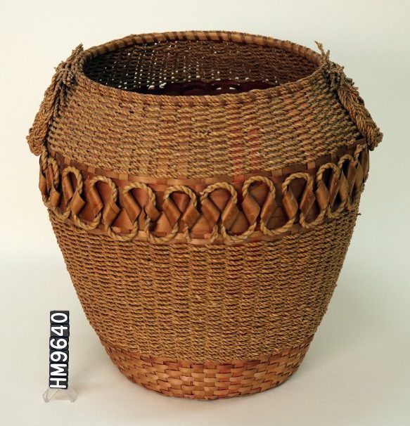 Image of basket with sinuous decoration and twisted fiber elements.