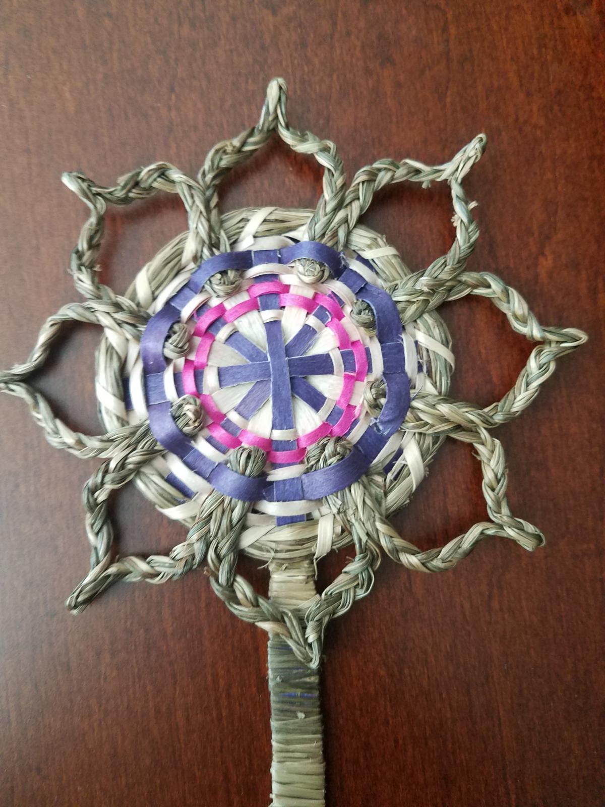 Woven bookmark with sweetgrass details.