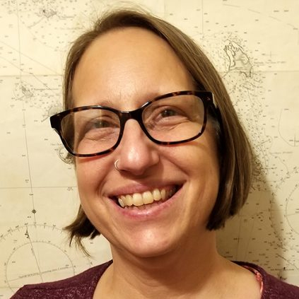 Image of Caucasian woman with a bob and glasses.