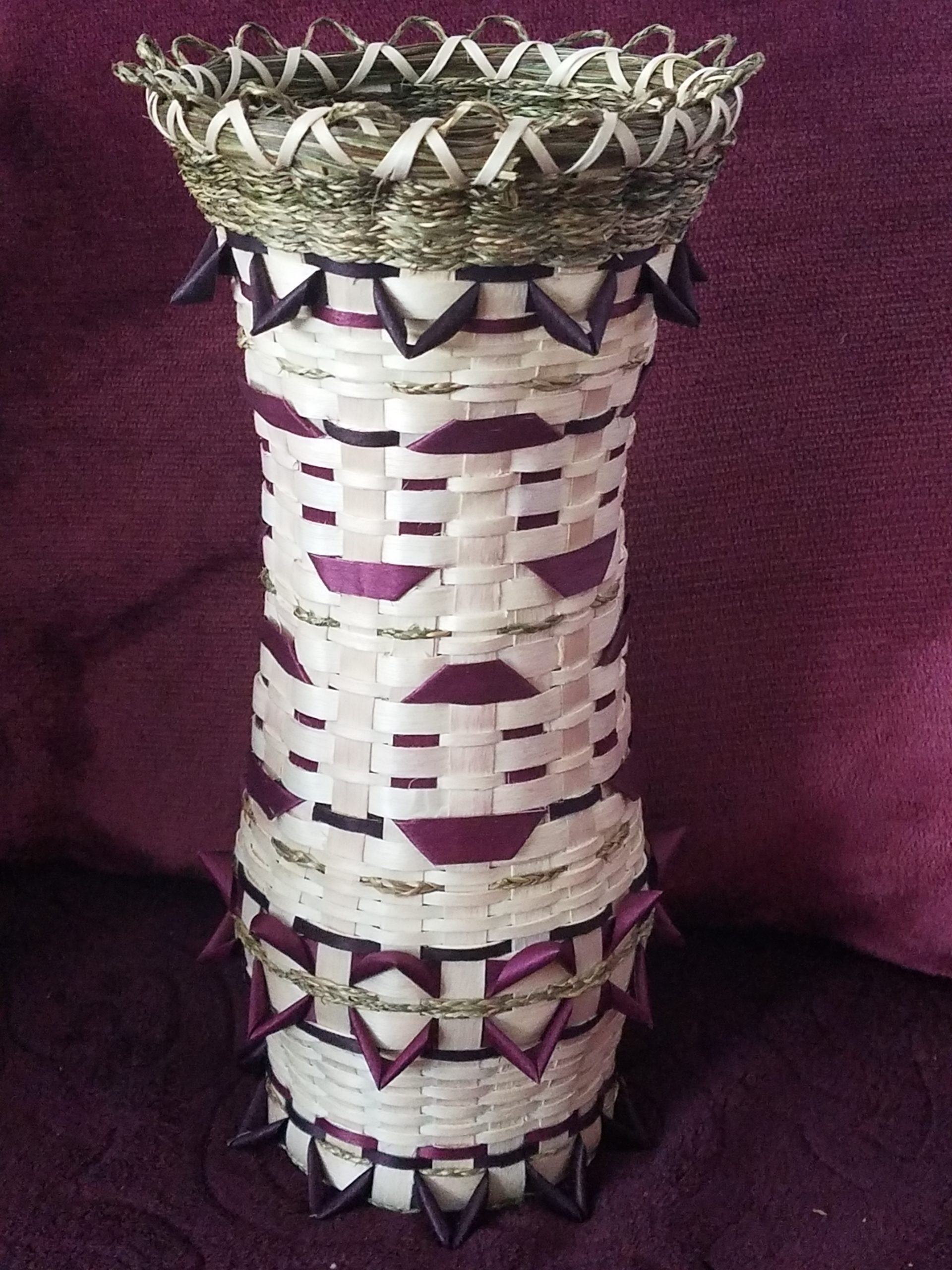Vase basket with deep purple details and sweetgrass.