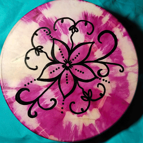 Image of a drum with a pink tie-dye background and a line drawn flower with double-curve designs.