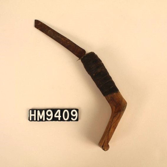 Image of a knife with blade set angled slightly "up" from handle and end of handle bent upwards as well.