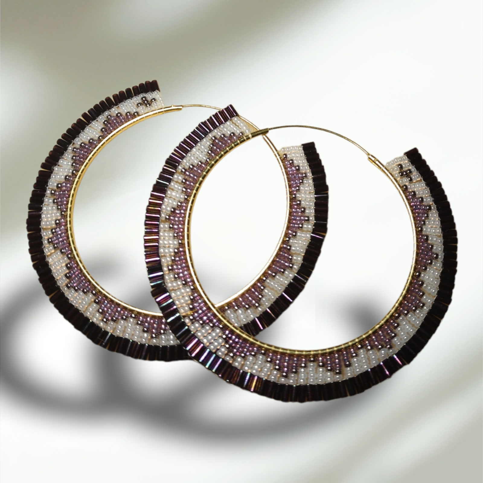 Image of beaded earrings in the form of large hoops.