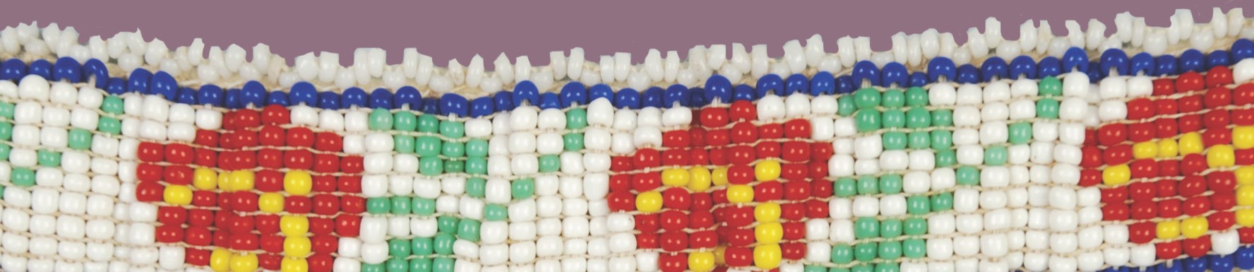 Detail image of a beaded object with a rose motif.