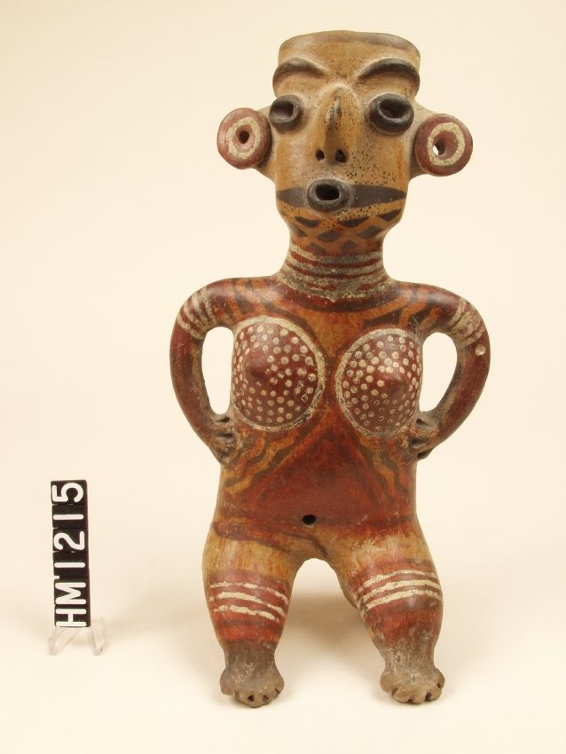 Ceramic figure with large ear spools and clear surface decorations.