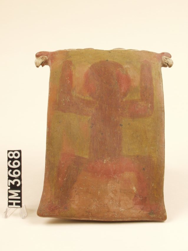 Rectangular ceramic tablet with simple outline of a person - round head, arms bent up next to head, legs bent downward.