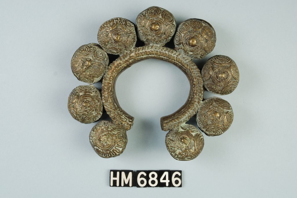 Image of copper bracelet with large decorative orbs around circumference.