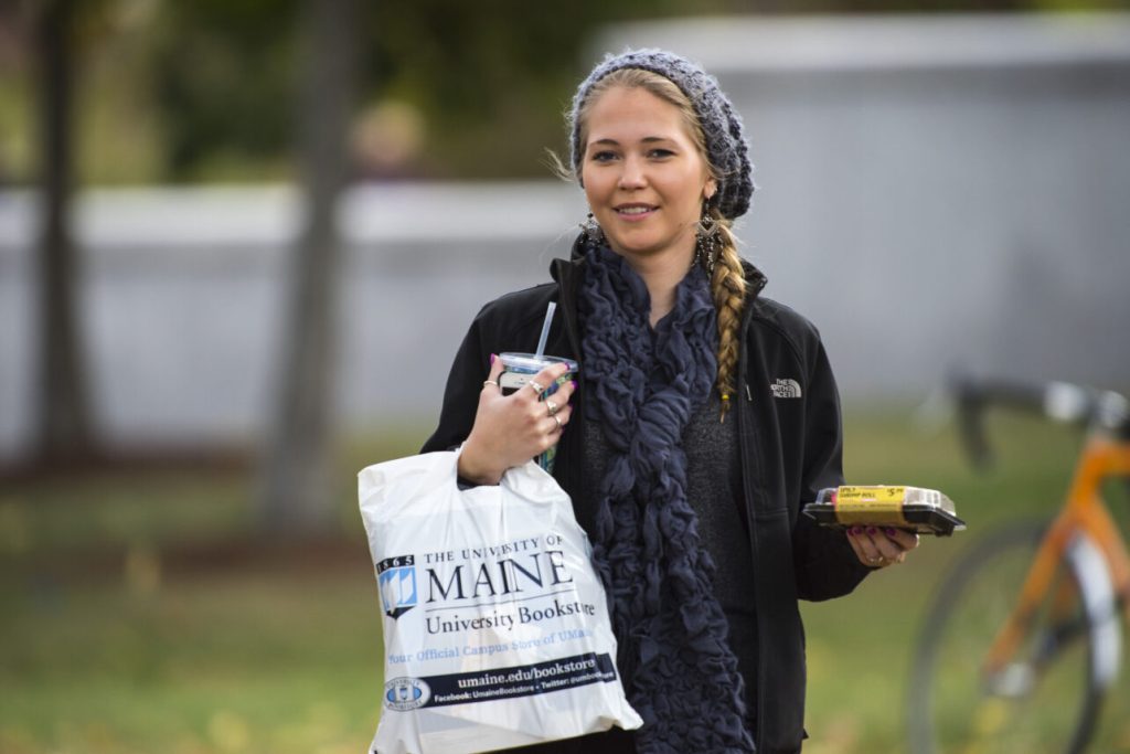Female student holding shopping bag