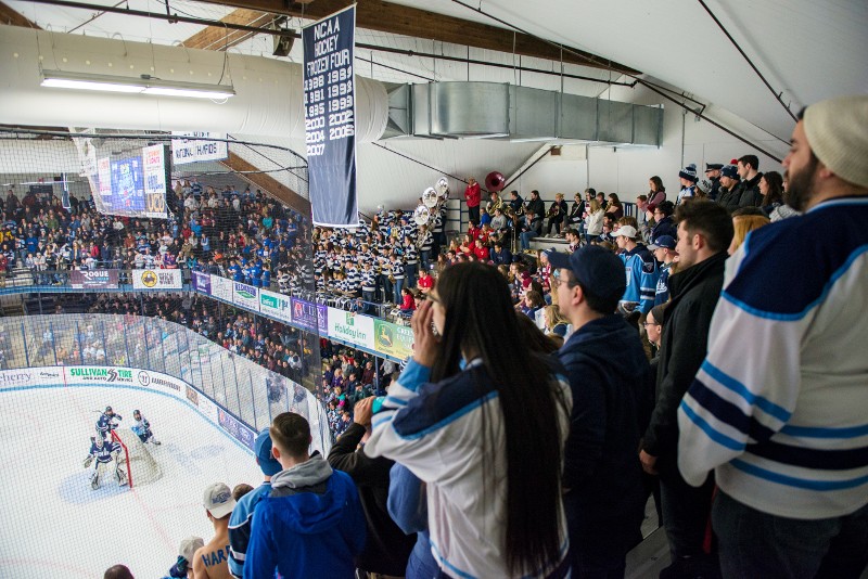 Students cheering for UMaine men's hockey team