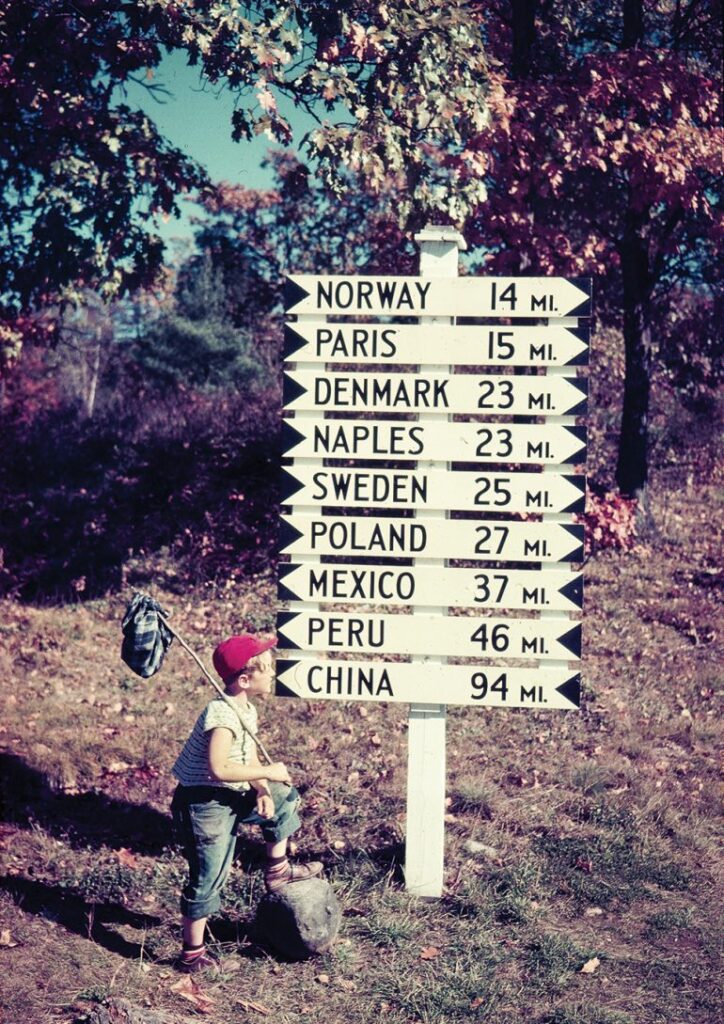 Funny signpost with Maine towns named after countries