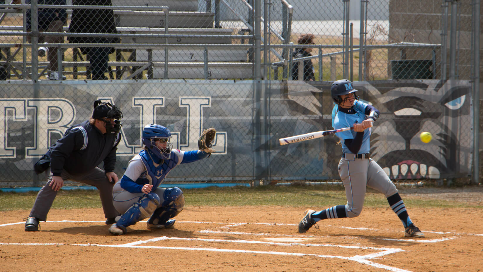 UMaine softball player at bat