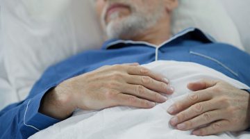 Elderly man in bed