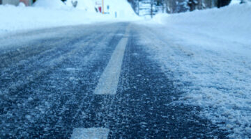 A photo of a winter road covered in snow