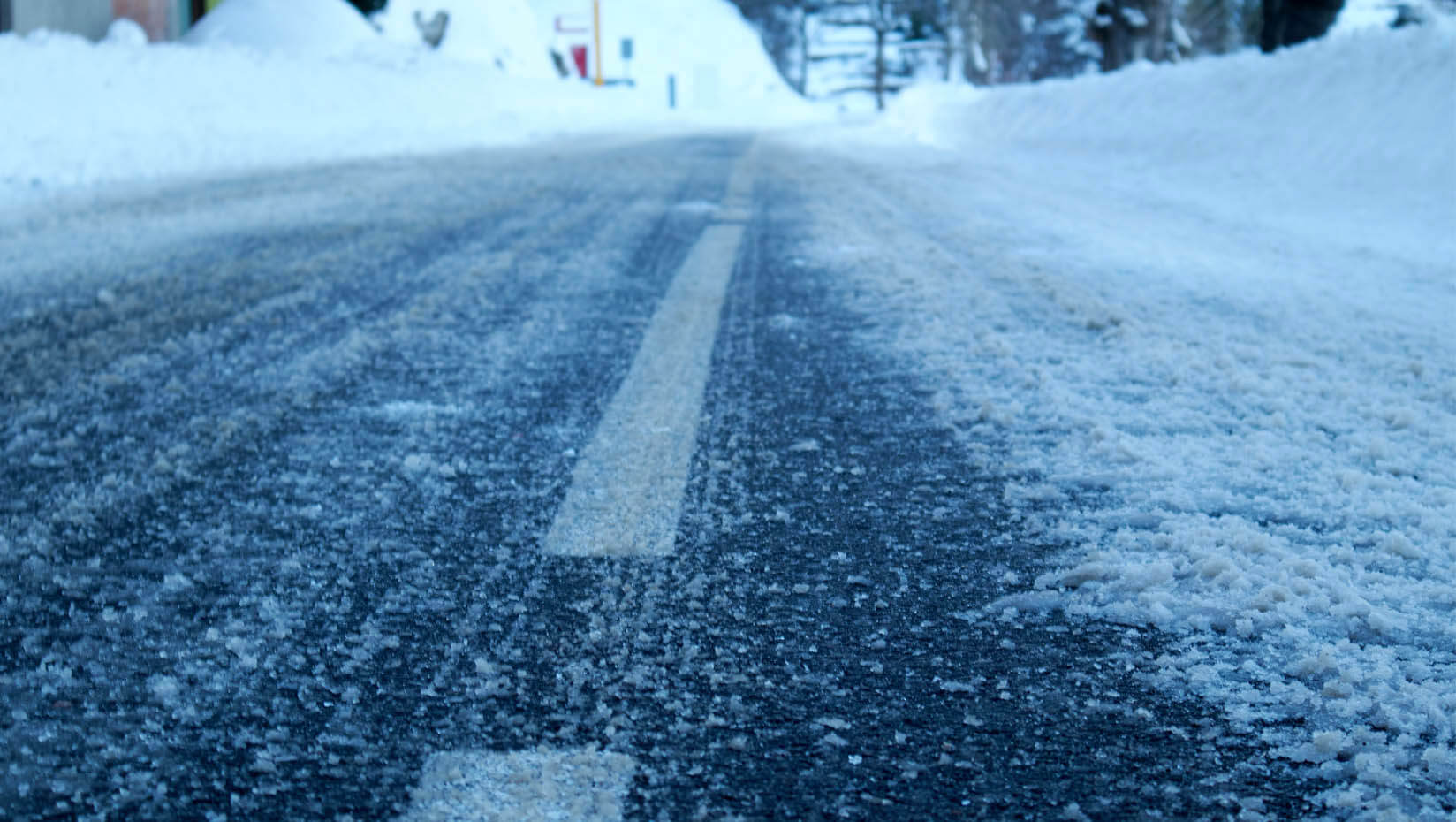 A photo of a winter road covered in snow