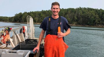 A photo Struan Coleman on a boat